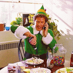 a man dressed as an elf is pouring something into a glass