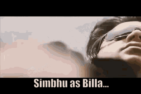 a close up of a man wearing sunglasses with the words simbhu as billa .