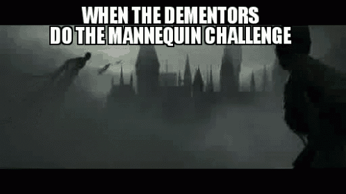 when the dementors do the mannequin challenge , a man is flying through the air in front of a castle in the fog .