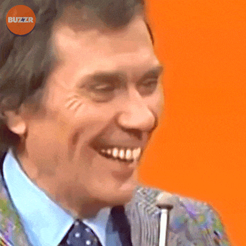 a close up of a man 's face with buzzr written on the bottom
