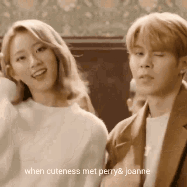 a man and a woman are standing next to each other with the caption " when cuteness met perry & joanne " on the bottom