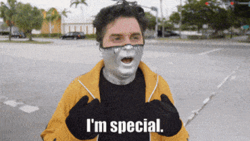 a man wearing a mask and gloves says i 'm special