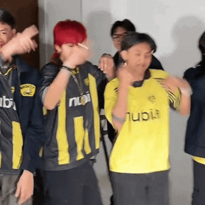 a boy with red hair is wearing a yellow shirt that says ' nubi ' on it
