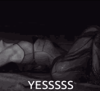 a black and white photo of a woman with the words yesssss on the bottom right