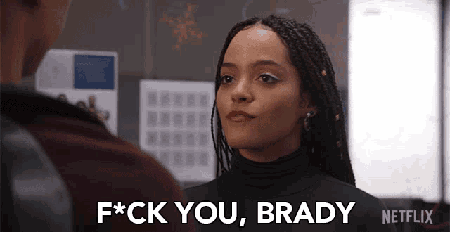 a woman says f * ck you brady while looking at a man