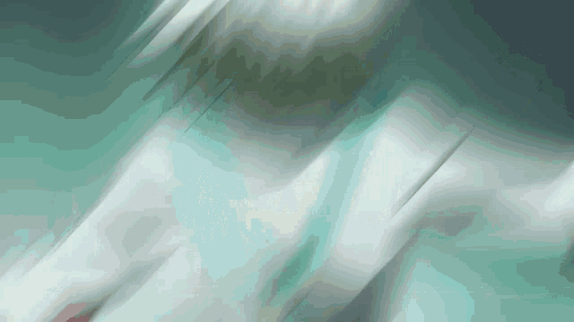 a blurred image of a person 's torso with a green background
