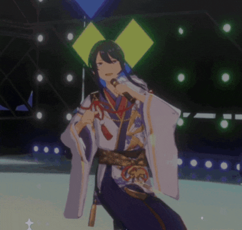 a man in a kimono is holding a microphone