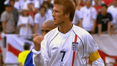 a soccer player wearing a white jersey with the number 7