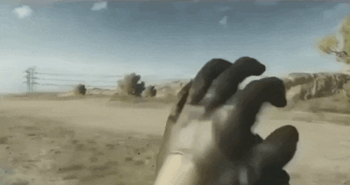 a close up of a person 's hand in a video game with a blurred background .