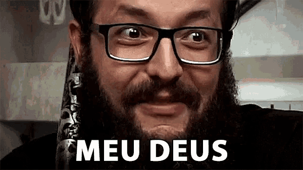 a man with glasses and a beard is making a funny face and the words meu deus are behind him .