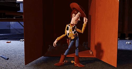 a toy story character named woody is standing in a cardboard box
