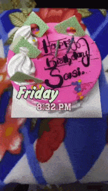 a pink birthday cake with the date friday 8:32 pm written on it