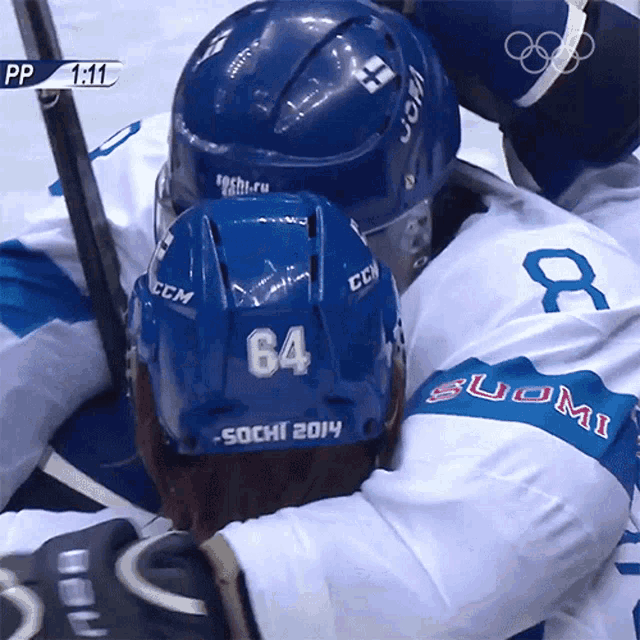 a hockey player with the number 64 on their helmet