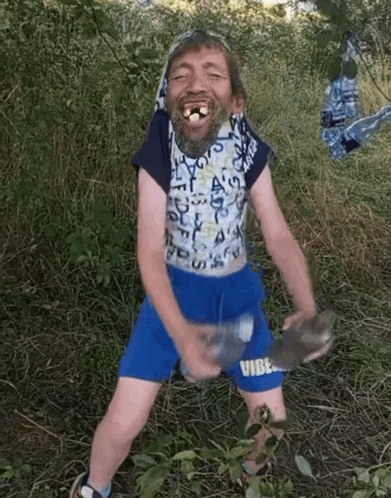 a man wearing blue shorts that say vibe