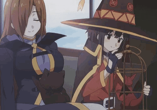 a girl in a witch hat is holding a cage with a cat in it
