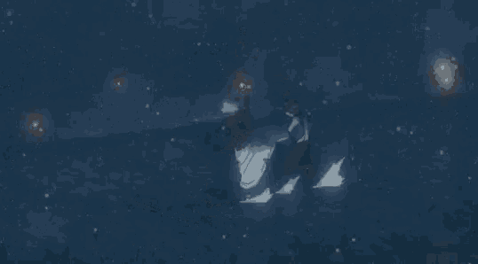 a couple of people are standing in the water with a few lights in the background