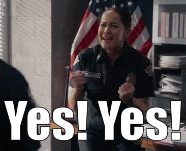 a woman in a police uniform is standing in front of an american flag and says yes