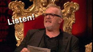 a man sitting in a chair holding a piece of paper that says listen on it