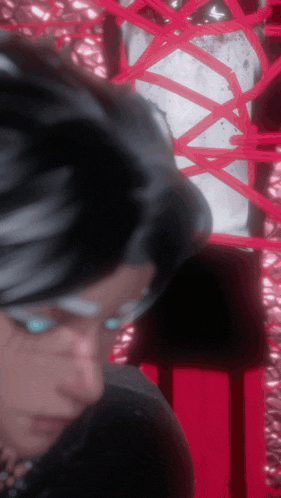 a close up of a person 's face with a red ribbon behind them