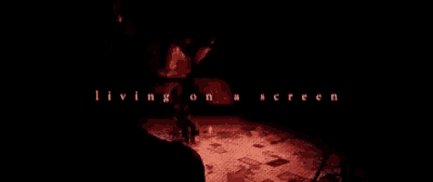 a movie poster for living on a screen shows a man in a dark room .