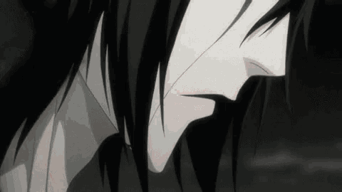 a close up of a person 's face in a black and white anime scene .