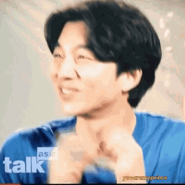 a close up of a man 's face with the words asia talk in the corner