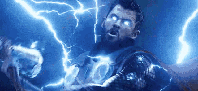 thor is being struck by lightning in a scene from avengers : endgame .