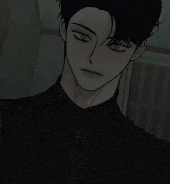 a blurred image of a person standing in a dark room with a white light coming out of the corner .