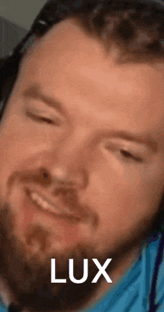 a close up of a man 's face with the word lux written on it