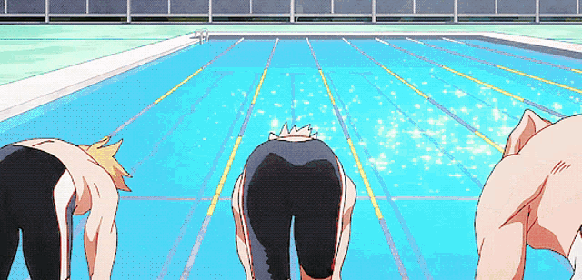 a group of people are getting ready to swim in a pool