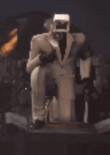 a statue of a man in a suit and tie is sitting on a chair .