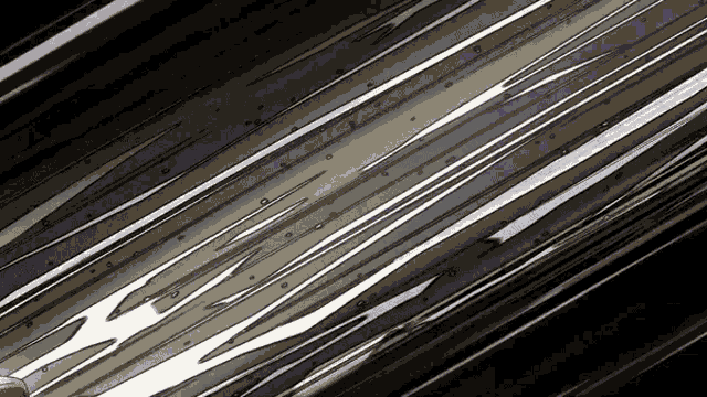 a close up of a metal surface with a few lines