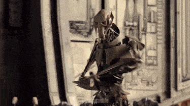 a statue of general grievous from star wars is standing in a room .