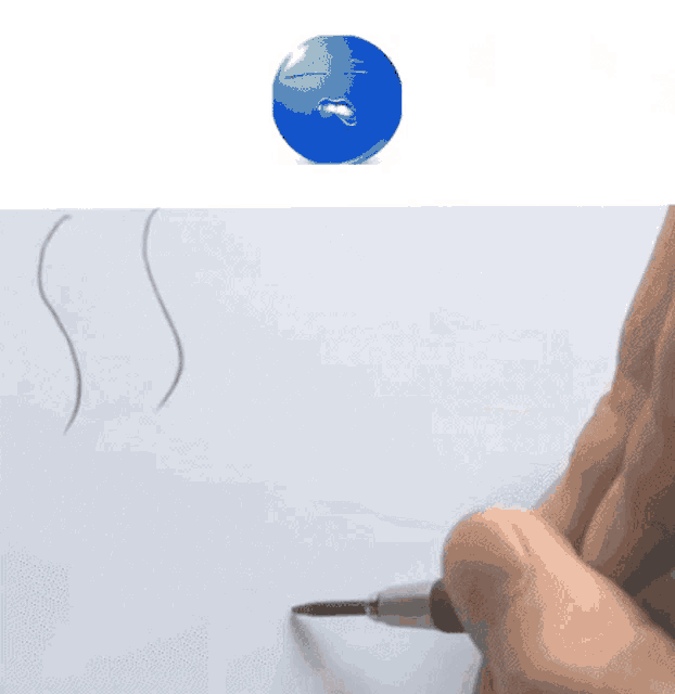 a person is drawing a smiley face with a pencil on a piece of paper
