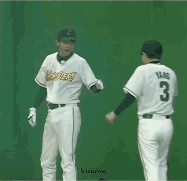 two baseball players are dancing in front of a green background with hearts and the name backairan on the bottom right