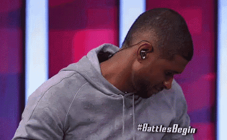 a man wearing headphones and a hoodie with the words battles begin written on the bottom