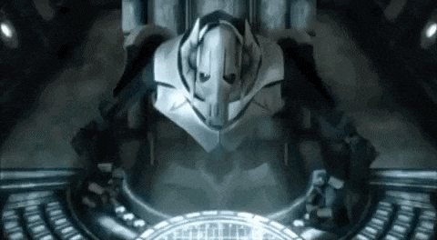 a robot is sitting in a dark room with a circle in the middle of it .