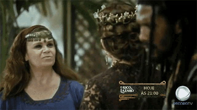 a woman with a crown on her head stands next to a man and a sign that says o rico lazaro