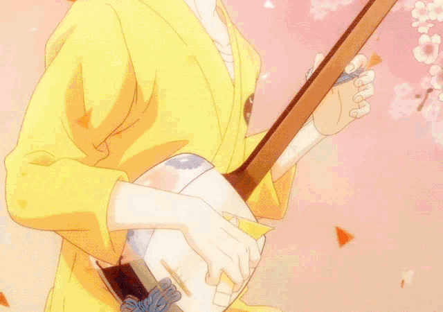 a close up of a person 's hand holding a fan with the letter c on it