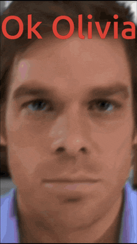 a close up of a man 's face with the words ok olivia written above it