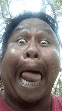 a man is making a funny face with his tongue sticking out