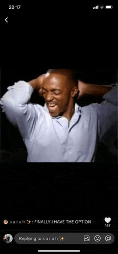 a phone screen shows a man with his hands on his head and a reply from sarah