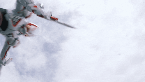 a robot is flying through the air with a sword in its hand