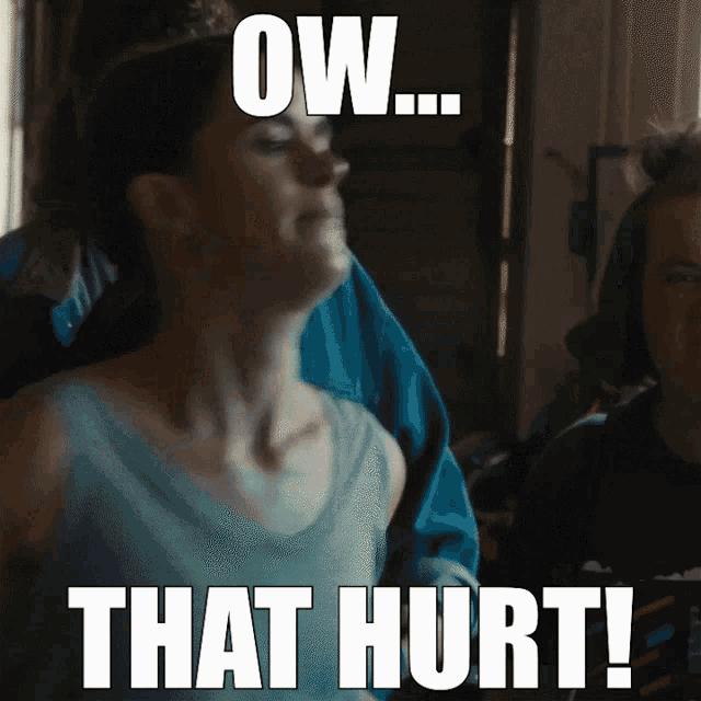 a woman in a blue tank top with the words ow that hurt