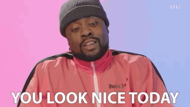 a man wearing a pink jacket with palm angels on it says you look nice today