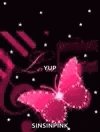 a pink butterfly is flying in the dark with stars .