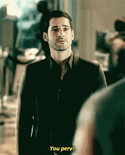 a man in a suit and tie is talking to another man and says you perv