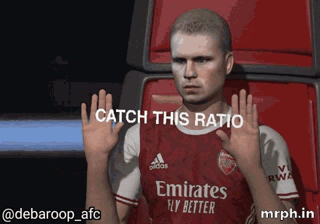 a man wearing a red emirates fly better shirt