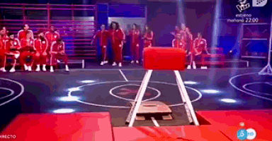 a group of people are on a stage with a sign that says the voice