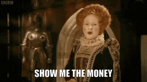 a woman in a costume says show me the money in front of a statue